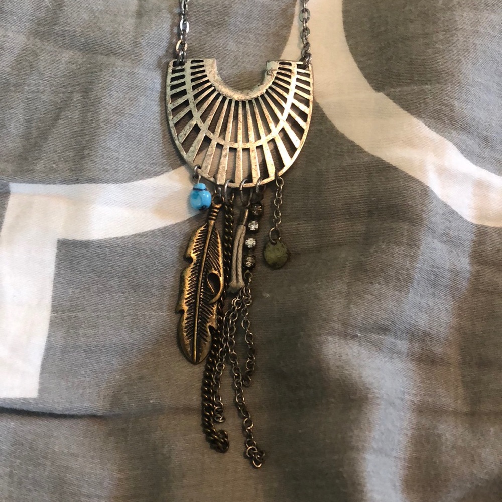 Long silver necklace with charms